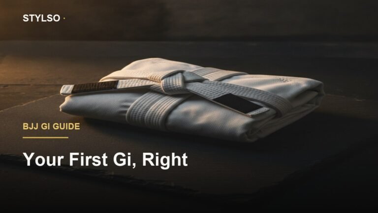 White BJJ gi folded on dark slate — best BJJ gi for beginners guide by Stylso