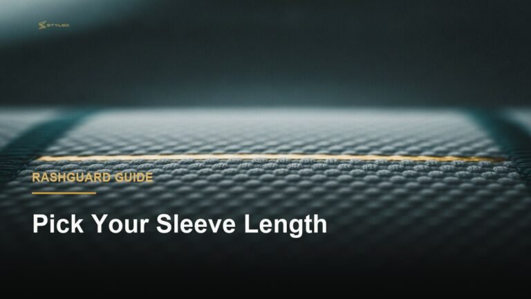Close-up macro texture of a BJJ rashguard fabric under dramatic gold-toned studio lighting, showing compression weave detail