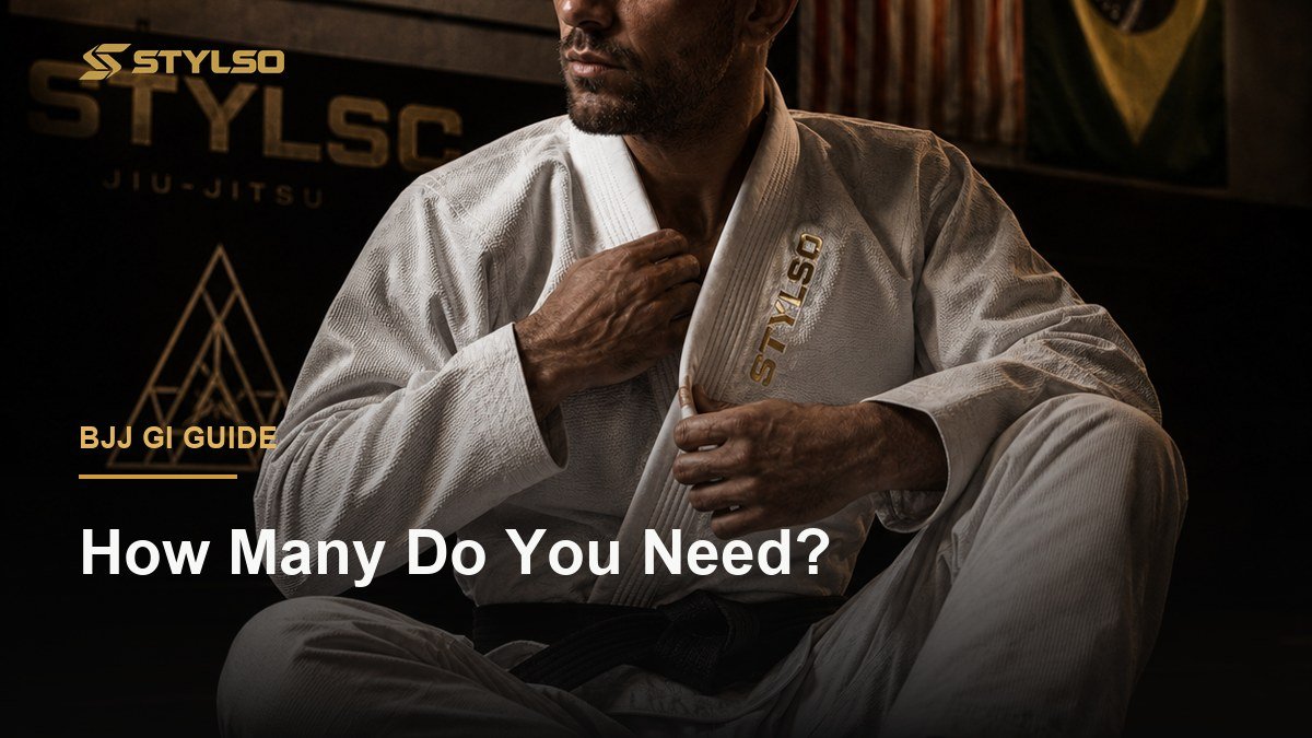 BJJ athlete in white gi sitting on the training mat — deciding how many gis to own